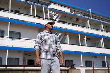 River cruise ship passenger enjoying sunny vacation day