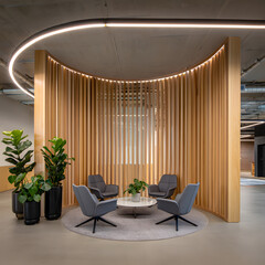 Modern minimalist office lounge: curved wood partition, gray chairs, plants, warm lighting.