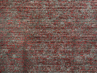 Close up texture of red and grey upholstery fabric, made of woven cotton and polyester. Fluted stripes texture. Suitable for upholstery and carpet rug. Seamless background texture.