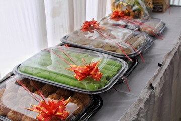A festive arrangement of food platters with vibrant decorations