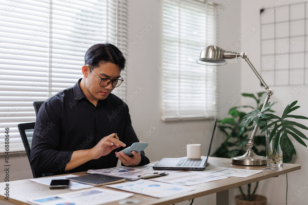 Poster businessman calculating finance using calculator app on smartphone