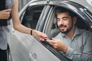 Male customer receiving keys from female dealer after new car purchase, representing trust, satisfaction, and joy in automotive, insurance, and finance sales.