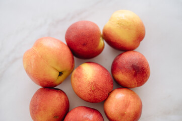 Beautiful ripe nectarine with aromatic skin, top view of fresh summer fruit