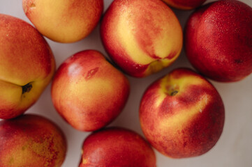 Beautiful ripe nectarine with aromatic skin, top view of fresh summer fruit