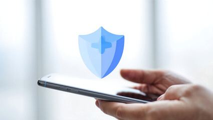 Digital security shield hovering over a smartphone held by a person