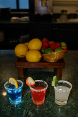 Colorful fruit cocktails with lemon, lime, and strawberry
