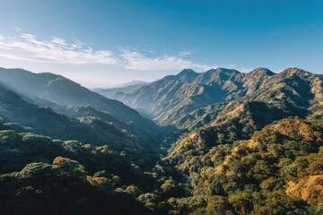 Mountain valley vista with sunlit peaks
