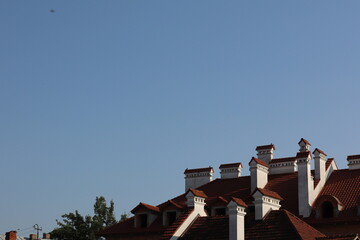 Historic buildings under clear blue sky in a sunny neighborhood during the afternoon