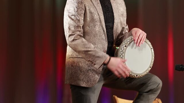 man playing the darbuka drum