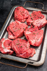 Raw beef boneless shank shin meat with herbs and spices ready for cooking. isolated on white background. top view