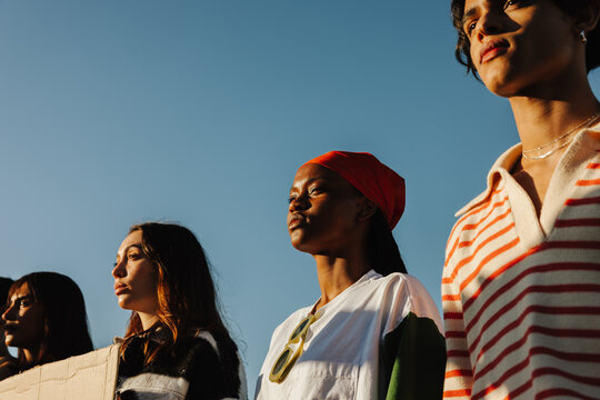 Group of diverse young people standing together during a peaceful protest