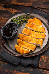 Katsu Golden fried cutlet. This Japanese favorite brings comfort and flavor to any table. wooden background. top view