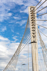 Obraz premium Modern architecture of Millennium Bridge against blue sky, Podgorica, Montenegro urban landmark perspective