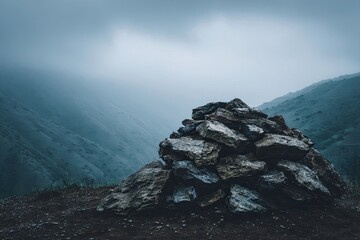 Misty mountaintop rock pile