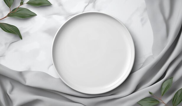 Minimalist white plate mockup on white background with soft gray fabric and fresh green leaves, elegant top view composition for culinary or restaurant menu design presentation - Powered by Adobe