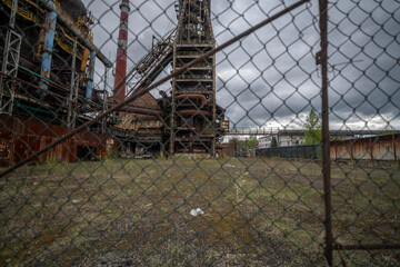 Abandoned Heavy Industrial Ruins with Large Blast Furnace in Steelworks