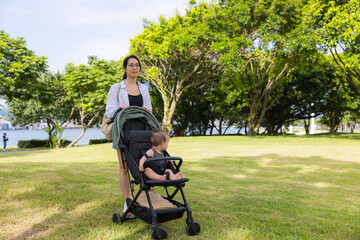 Mother take her baby son at the park
