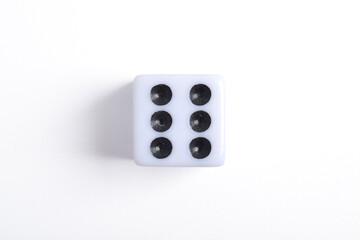 One white dice isolated on white background, top view