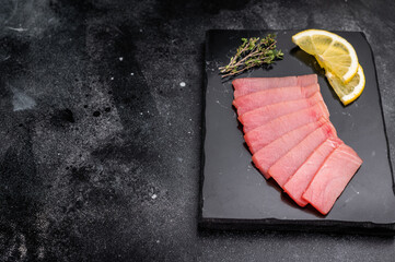 Premium quality tuna sashimi, ideal for a refreshing appetizer or light meal that delights the...