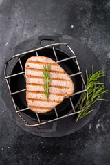 Juicy grilled tuna steak, perfectly seared with a smoky flavor, ideal for seafood lovers and...