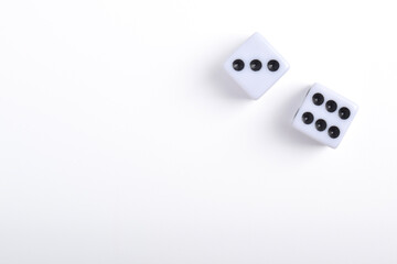 Two white dice isolated on white background, top view