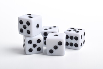 Five white dice on white background, symbolizing luck, chance, probability, and gaming concepts for board games