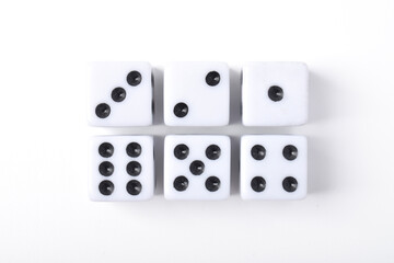 Six clean dices with Numbers 1, 2, 3, 4, 5, 6, isolated on white background, top view