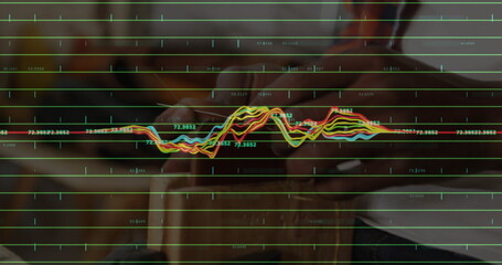 Grasping prosthetic hand and natural hand holding cylinder on lab bench, with data grid overlay