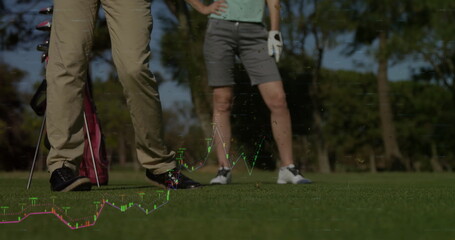 Fototapeta premium Standing couple wearing golf attire on golf course fairway, with golf bag, clubs, and glove
