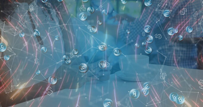 Two colleagues discussing cryptocurrency overlay in meeting room, with coffee cups and smartphone - Powered by Adobe