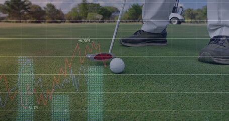 Aligning golfer wearing grey trousers placing putter head behind golf ball on green with overlays