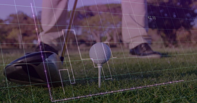 Aligning golfer wearing beige golf pants aiming driver behind ball on fairway, with grid overlay