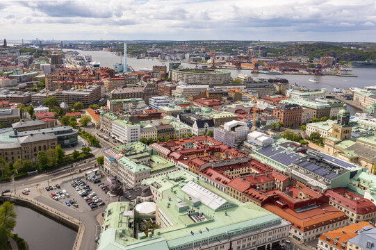 Aerial view of the vibrant city with its colorful rooftops, the Gota alv river snaking through, and the iconic Masthugg Church standing tall, Gothenburg, Vastra Gotaland, Sweden.