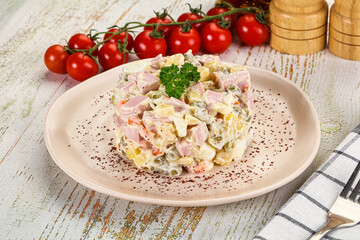 Russian traditional Olivier salad with sausages