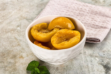 Canned marinated peach in syrop