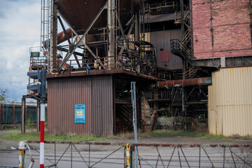 Abandoned Heavy Industrial Ruins with Large Blast Furnace in Steelworks