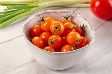 Ripe juicy yellow cherry tomato