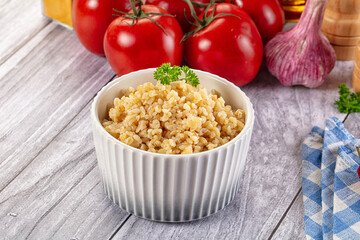 Vegan cuisine - boiled bulgur garnish