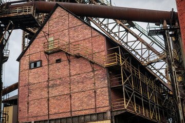 Abandoned Heavy Industrial Ruins with Large Blast Furnace in Steelworks