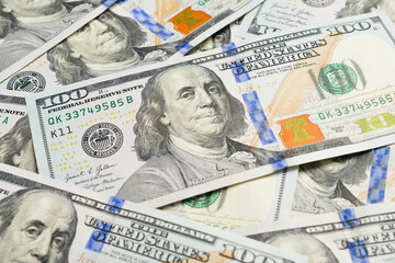Close-up of the image of American President Benjamin Franklin on a hundred dollar bill. Set of American dollar bills.
