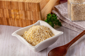 Raw dry sesame seeds heap