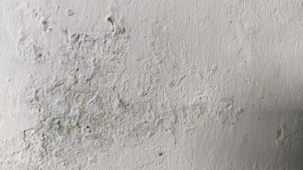 Damaged wall surface with horizontal texture showing cracks and aging signs, great for use in restoration-themed visuals or grunge design.