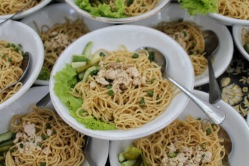 Delicious Bowls of Noodles Served With Fresh Vegetables and Garnishes