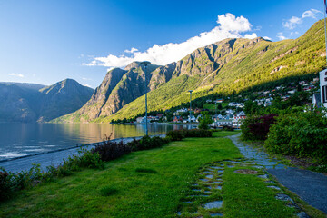 Fototapeta premium Coastal Norwegian Village with Mountain and Fjord View