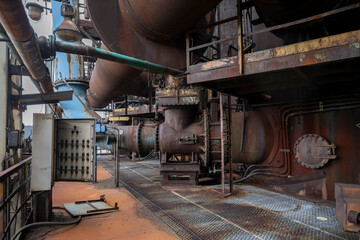 Abandoned Heavy Industrial Ruins with Large Blast Furnace in Steelworks