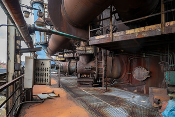 Abandoned Heavy Industrial Ruins with Large Blast Furnace in Steelworks