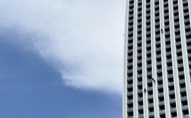 Group of industrial climbers on office skyscraper outdoors