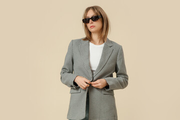 Serie of studio photos of woman in classic outfit, white shirt, pepito blazer and blue jeans.	