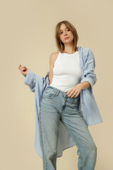 Serie of studio photos of woman in classic basic outfit - blue jeans, white tank top and blue...