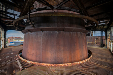 Abandoned Heavy Industrial Ruins with Large Blast Furnace in Steelworks